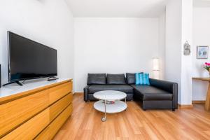 Televízia a/alebo spoločenská miestnosť v ubytovaní Jinetes Penthouse in Malaga by Solaga Holiday Homes