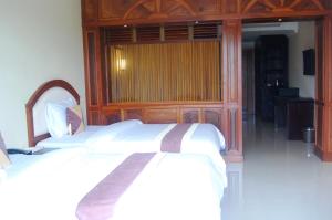 Rúm í herbergi á Classy Hotel & Spa