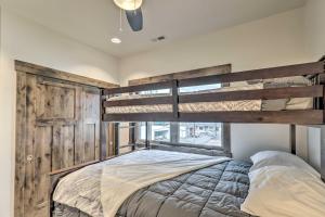 a bedroom with a bunk bed and a window at Sleek Columbia Falls Condo Centrally Located! in Columbia Falls