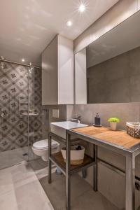 a bathroom with a sink and a toilet at Agence des Résidences - Appartements privés du 45 CROISETTE - Superieur in Cannes
