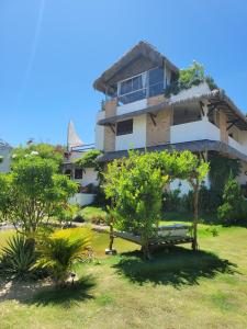 a building with trees in front of it at R.I.O in Cumbuco