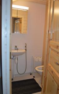 a bathroom with a sink and a toilet at Apartment Vuokatin Taika 1 - Loppusiivous sisältyy hintaan in Vuokatti +10 photos