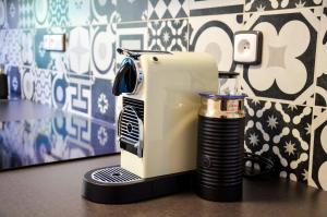 a toaster sitting on top of a counter with a cup at Apartmán u Vítka in Mikulov
