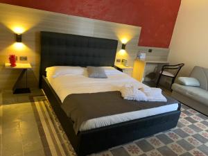 Postel nebo postele na pokoji v ubytování Mini Hotel Wf2 Caltagirone