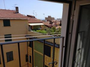 a balcony with a view of a city at La soffitta vicino al mare in Varazze