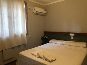 Cama ou camas em um quarto em Palace Hotel Mendoza