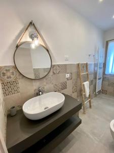a bathroom with a sink and a mirror at Floridida Rooms & Breakfast in Marina di Andora +27 photos