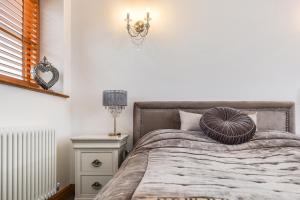 Postel nebo postele na pokoji v ubytování Crabden Meadows, Blendworth
