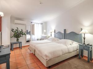 Cama ou camas em um quarto em ADC - Albergaria Do Calvário - by Unlock Hotels