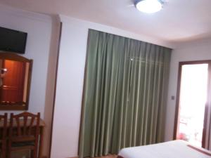 Postel nebo postele na pokoji v ubytování Hotel Elena María