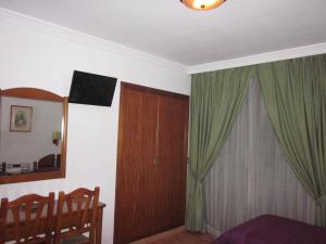 TV a/nebo společenská místnost v ubytování Hotel Elena María