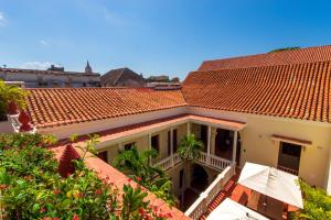 a view of a house with a red roof at Hotel Quadrifolio in Cartagena de Indias +99 photos
