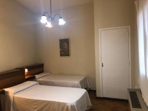 Cama ou camas em um quarto em Palace Hotel Mendoza