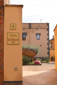 a building with a sign that reads casa tarpolis at Casa TAPIOLAS in Borrassá