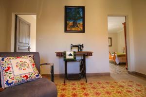 a living room with a couch and a table at Casa TAPIOLAS in Borrassá
