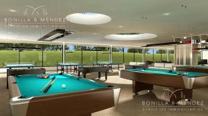 a billiard room with two pool tables in a building at Apartamento Punta del Este in Punta del Este