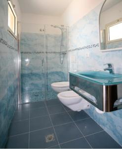 Koupelna v ubytování Hotel Riposo