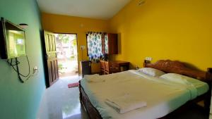 Postel nebo postele na pokoji v ubytování Shrushthee Guest House