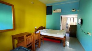 Postel nebo postele na pokoji v ubytování Shrushthee Guest House