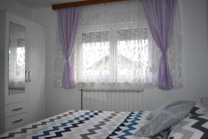 Posteľ alebo postele v izbe v ubytovaní Apartman Rukavina