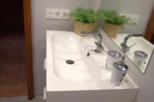 a bathroom with a white sink in a bathroom at CASA ALIS in Arrecife