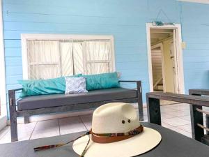 a hat sitting on a table in a room at Casa Pacífico in Quepos