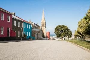 an empty street in a town with a church at 10 on Cape Self Catering Apartments in Port Elizabeth