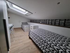 Un pat sau paturi într-o cameră la ESA Lodges