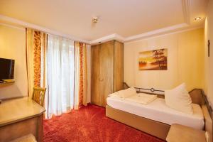Postel nebo postele na pokoji v ubytování Flair Hotel Zum Schwarzen Reiter