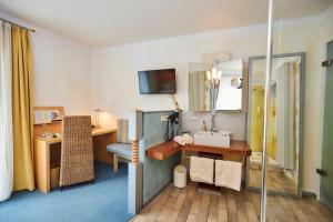 Postel nebo postele na pokoji v ubytování Flair Hotel Zum Schwarzen Reiter