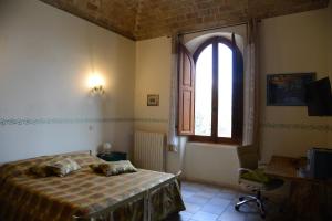 מיטה או מיטות בחדר ב-La Casa Di Andrea