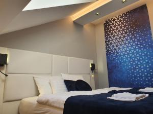Postel nebo postele na pokoji v ubytování Kaposvár Apartman