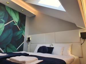 Postel nebo postele na pokoji v ubytování Kaposvár Apartman