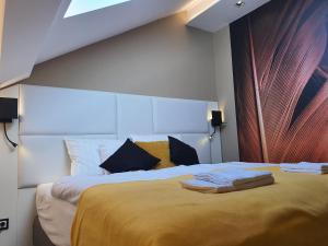 Postel nebo postele na pokoji v ubytování Kaposvár Apartman