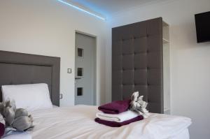 Rúm í herbergi á Villa Kiwi