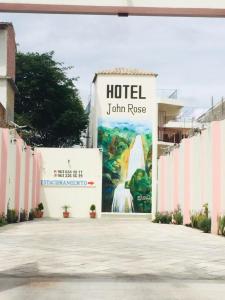 a sign that reads hotel jumrin rouse on a building at Hotel John & Rose in Comitán