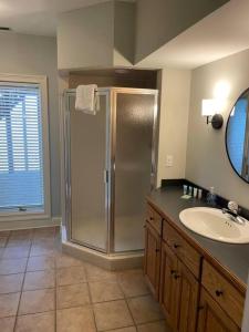a bathroom with a shower and a sink at Main Channel Manor in Cadiz