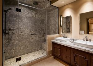 a bathroom with two sinks and a shower at The Cromwell Hotel & Casino in Las Vegas