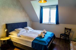 Posteľ alebo postele v izbe v ubytovaní Dominium Pincészet és Panzió