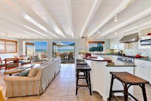 a large kitchen with a couch and a table at Tommy Bahama Beach in Dana Point