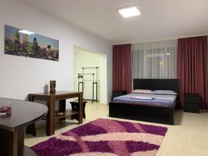 En eller flere senge i et værelse på ELI Apartment