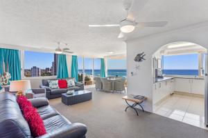 a living room with a view of the ocean at Southern Cross Beachfront Holiday Apartments in Gold Coast