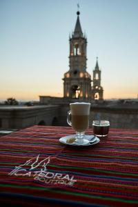 a cup of coffee sitting on top of a table at Catedral in Arequipa