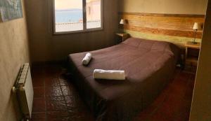 Postel nebo postele na pokoji v ubytování Bariloche Hostel