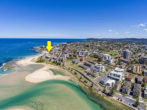 an aerial view of a beach with a yellow arrow at Calypso, Unit 1 - The Entrance, NSW in The Entrance