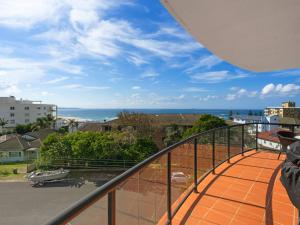 a balcony with a view of the ocean at Crystal Waters Unit 11 in The Entrance