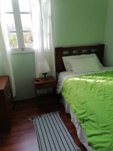 Katil atau katil-katil dalam bilik di Hostal los Almendros de Canela