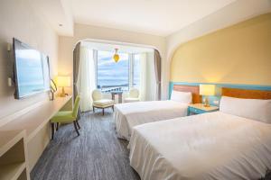 Voodi või voodid majutusasutuse Kenting Long Beach Hotel toas