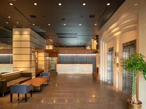 a lobby of a hospital with a waiting room at EN HOTEL Hamamatsu in Hamamatsu