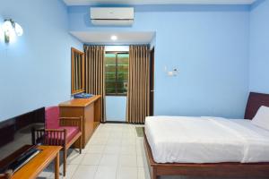 A bed or beds in a room at Sekar Ayu Hotel Malioboro Mitra RedDoorz